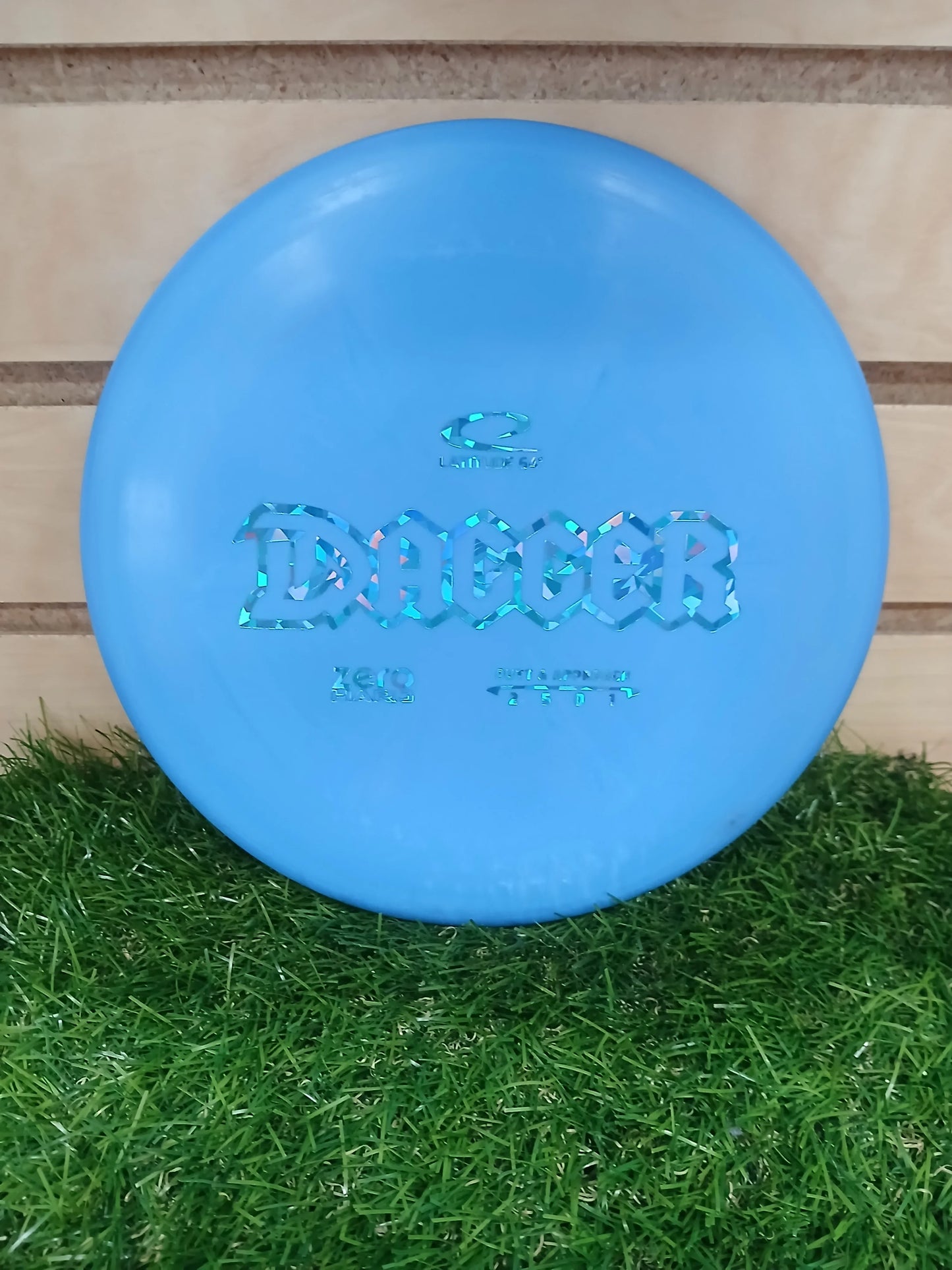 Blue Latitude 64 Dagger disc golf disc on grass, Zero Plastic, putt & approach