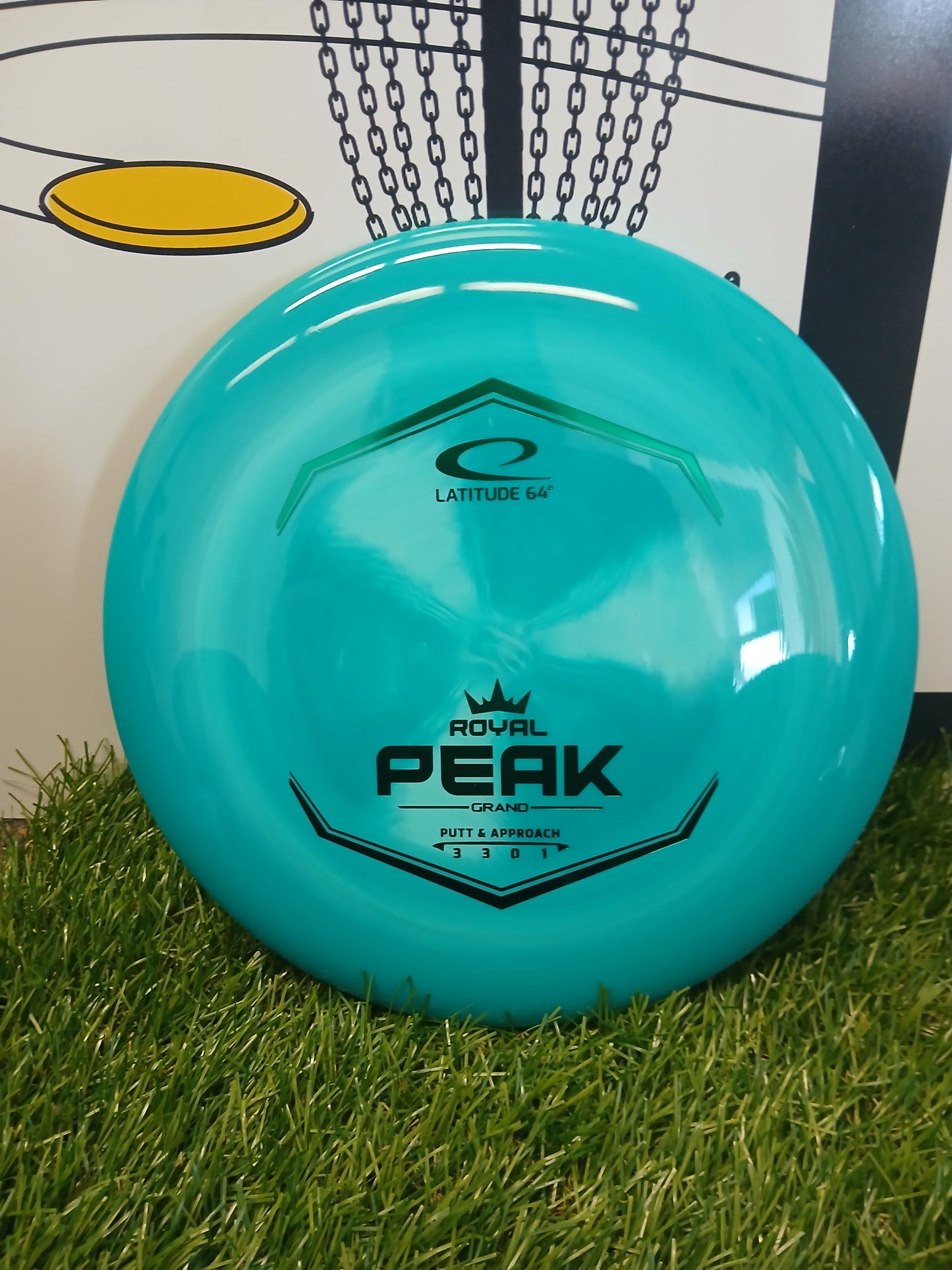 Latitude 64 Royal Peak Grand putter disc golf disc on grass, ideal for putt & approach shots