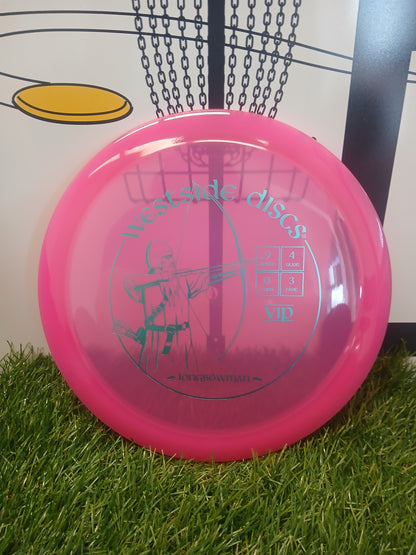 Pink Westside Discs Longbowman VIP disc golf disc on grass, featuring archer design and flight numbers