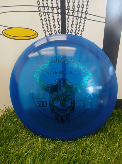 Blue Westside Discs Underworld VIP disc golf driver on grass, PDGA approved with speed 7, glide 6, turn -3, fade 1