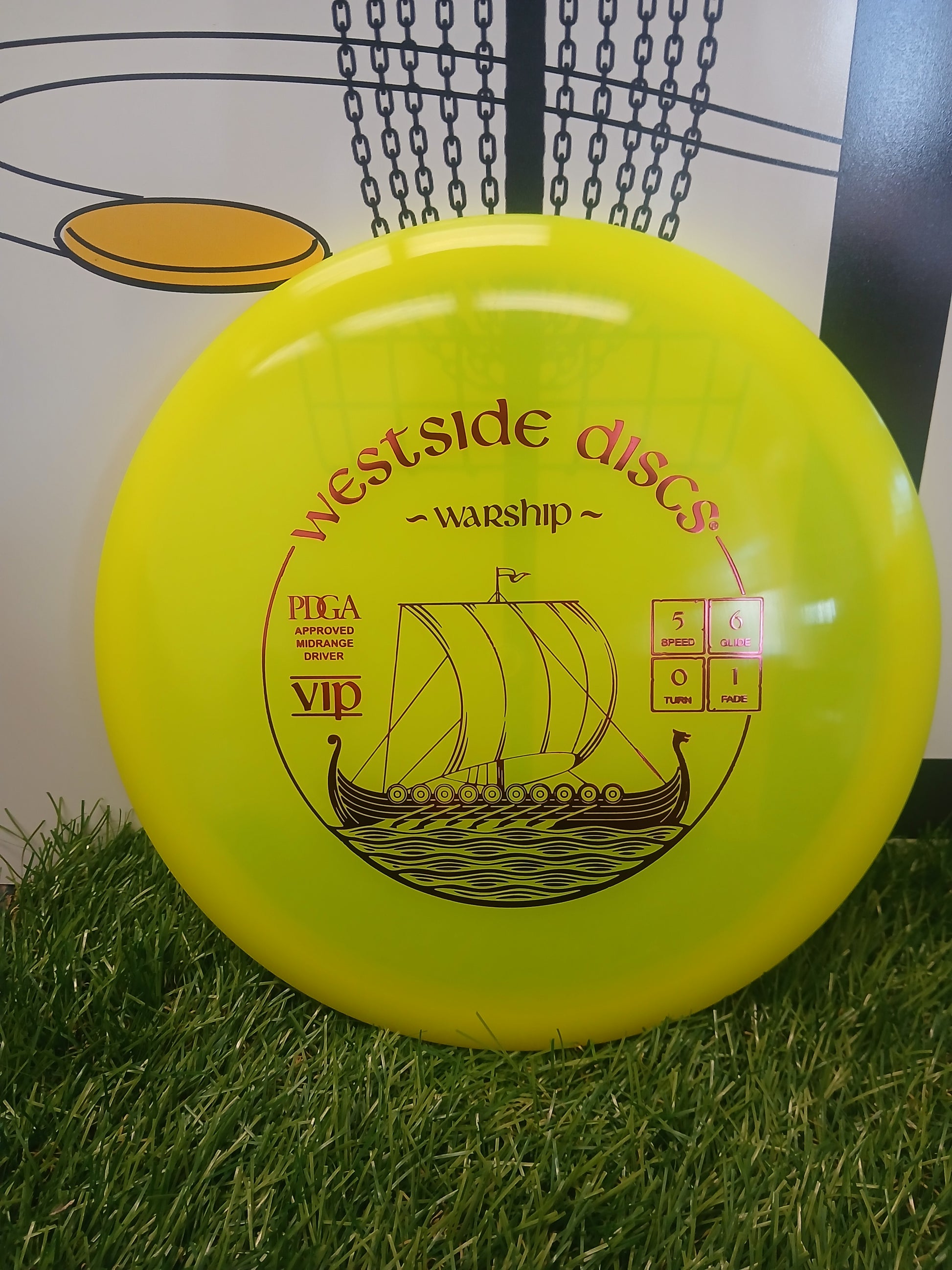 Westside Discs Warship VIP midrange driver disc golf disc on grass, PDGA approved with speed 5, glide 6