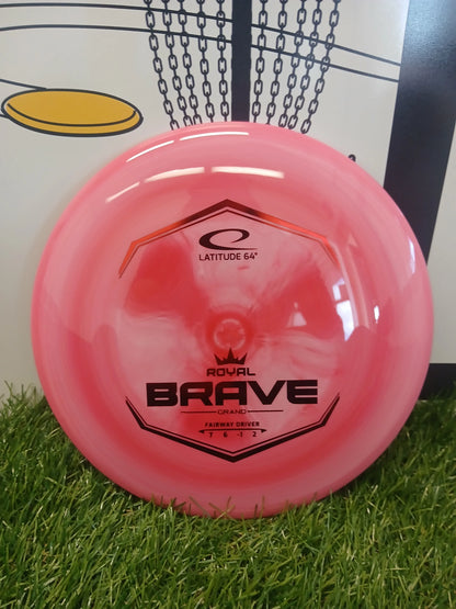 Pink Latitude 64 Royal Brave Grand fairway driver disc golf disc on grass