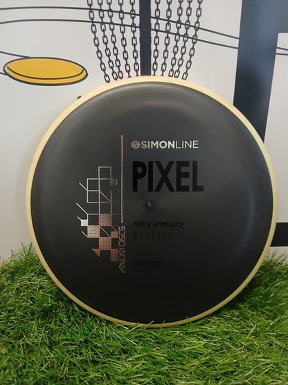 Simonline Pixel putter disc golf disc, Electron plastic, for putt & approach, on grass with chain basket background