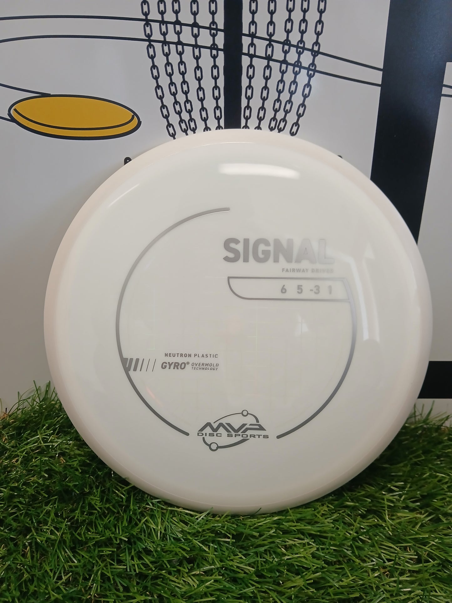 White MVP Disc Sports Signal fairway driver disc on grass, featuring Neutron plastic and Gyro technology