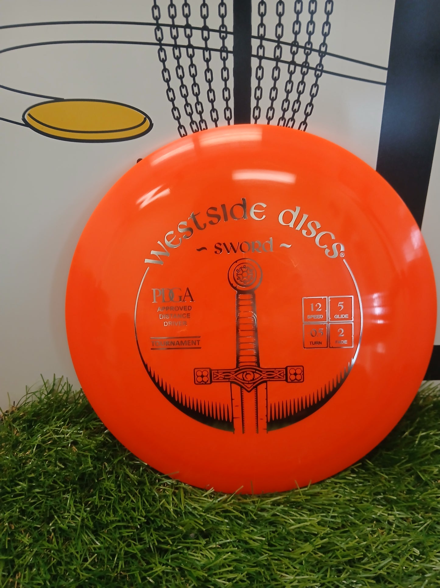 Westside Discs Sword PDGA Approved Distance Driver disc golf disc on grass