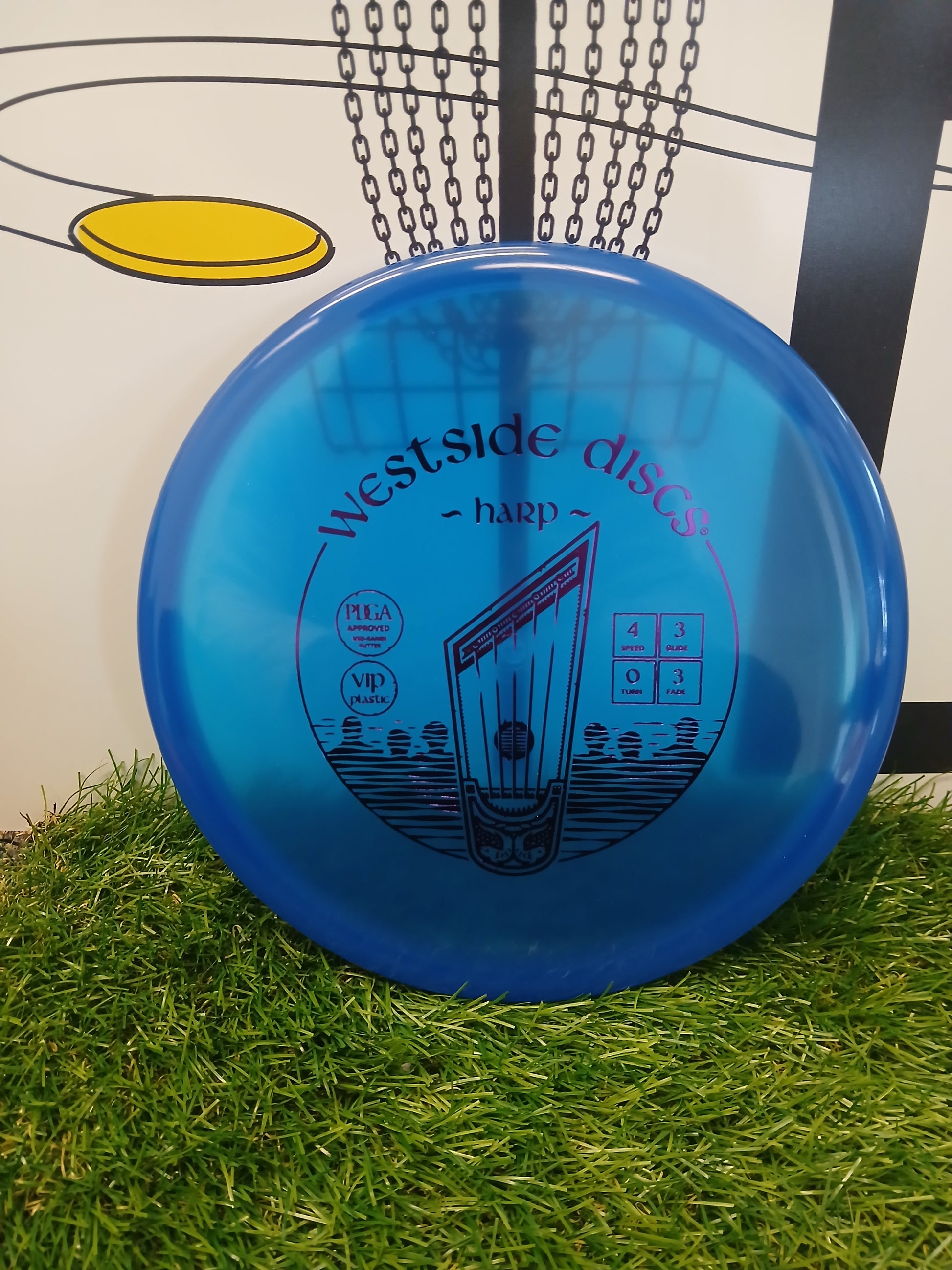 Westside Discs Harp VIP plastic disc golf putter on grass, PDGA approved with flight numbers 4/3/0/3
